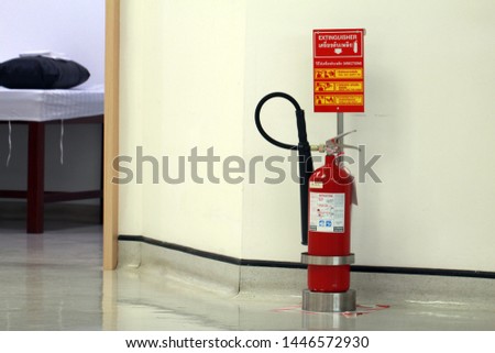Handheld fire extinguisher with stand and convenience to use