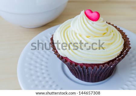 Vanilla cupcake on the wood table