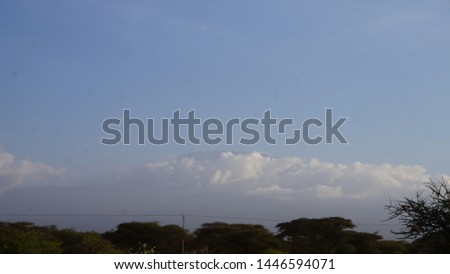 
Mount Kilimanjaro hovering above the clouds in Tanzania, seen from Amboseli in Kenya