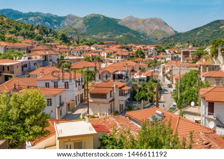 Summer day in mountain town. Traveling concept. Vacation background. Greek island of Euboea island, Greece. Greek old city, down town. View of Kimi, Greece. Amazing Skopelos old town by day