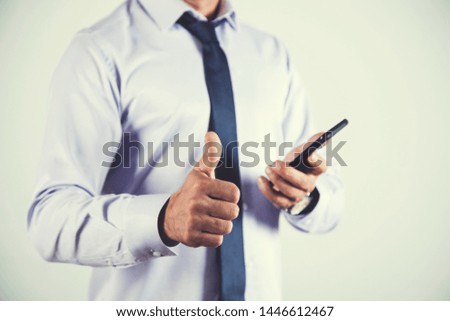 young man hand phone with okay sign