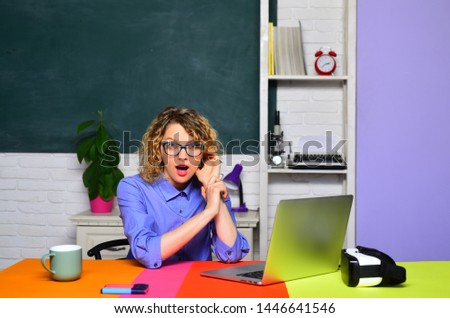 Teachers day. Teacher preparing for university exams. Young teacher. Learning and education concept. Exam in college. Professor at school lesson at desk in classroom. Female teacher near blackboard.