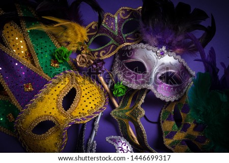 Mardi Gras masks on a dark background