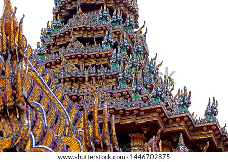 Traditional Thai style stucco on the roof of Buddhism church in temple 