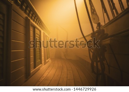 Old Pirate Ship sailing through fog Royalty-Free Stock Photo #1446729926