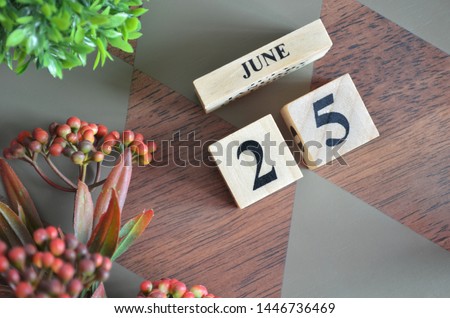 Date of June month. Diamond wood table for background.