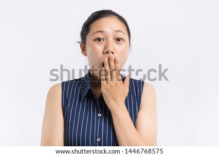Shocked surprised plus size adult woman covering her mouth with hand, being terrified or scared. Female seeing something shocking and speechless.
