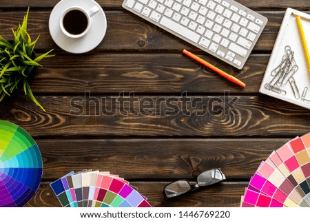 Designer work space with pallet, glasses, keyboard and coffee on wooden background top view mockup