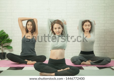 Woman group are exercise meditation yoga in gym for good lifestyles, meditation healthy for good health and care 