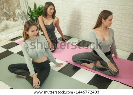 Woman group are exercise meditation yoga in gym for good lifestyles, meditation healthy for good health and care 