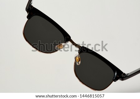 Stylish sun glasses on a white background.