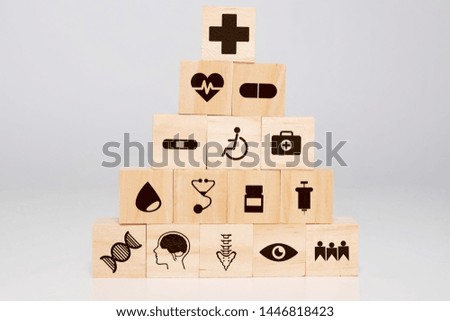 Insurance and healthcare concept on the wooden block. 