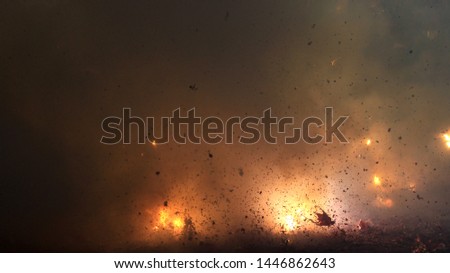 A photograph of fireworks being set off at a street festival in Taiwan with smoke, debris and noise abstracting the image. Royalty-Free Stock Photo #1446862643