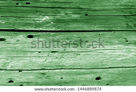 Old grunge wooden fence pattern in green color. Abstract background and texture for design.