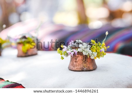 Traditional folklore  Bulgarian decoration with copper decorated with fresh flowers for a special holiday