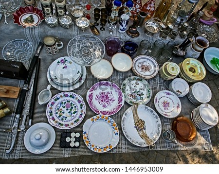 porcelain plates with beautiful pictures at the flea market