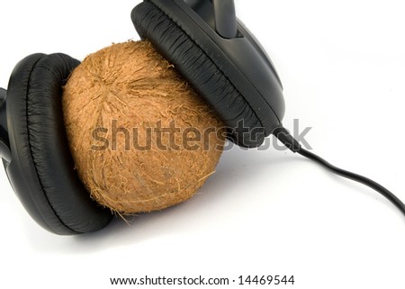 headphones on coconut isolated on white