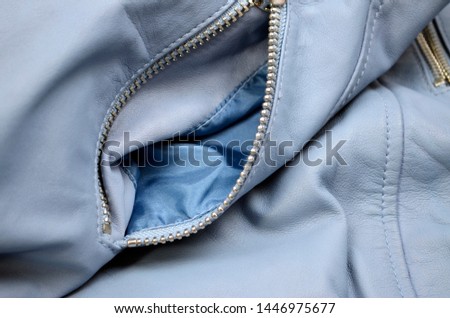  Zipper on pocket of the  leather jacket.