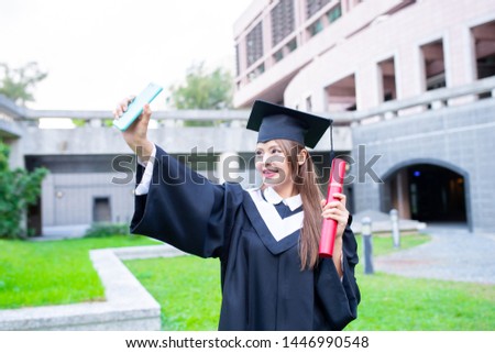asian girl gratuate taking selfie happily at campus 