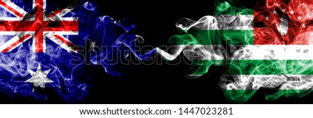 Australia vs Abkhazia, Abkhazian smoky mystic flags placed side by side. Thick colored silky smokes combination of national flags of Australia and Abkhazia, Abkhazian