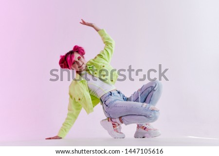 woman with pink hair sat down stylish clothes