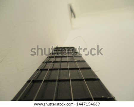 black acoustic guitar with white background