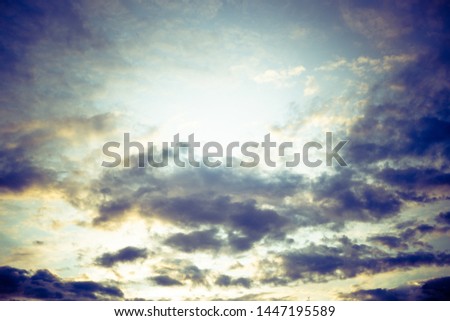 Gloomy golden sky with clouds background