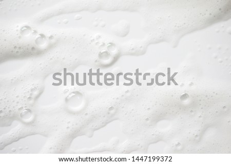 Abstract background white soapy foam texture. Shampoo foam with bubbles Royalty-Free Stock Photo #1447199372