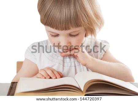 Pretty little girl reading an interesting book; isolated on white