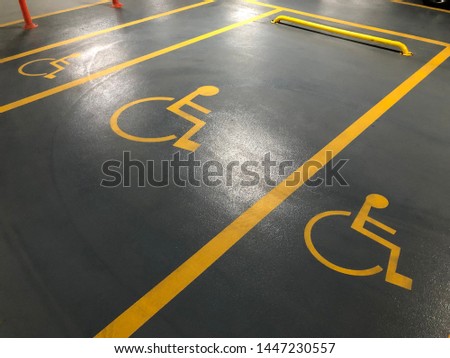 Sign of disabled parking. In the parking lot of the mall. 