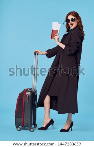 Elegant woman suitcase passport plane ticket journey flight