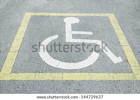 Symbols drawn road handicapped parking and signage