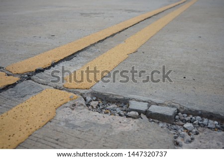 Concrete road cracks waiting for repairs Traffic route users should drive carefully.