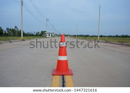 Red rubber cone placed on the road to ensure safety