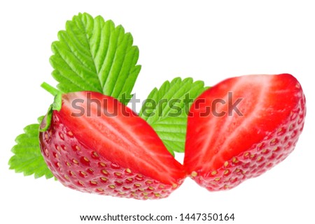 Cut strawberries isolated on white background. Green leaf in the background
