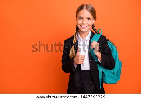 Close up photo beautiful she her little lady funky funny hairdo hand arm thumb raised up approval quality news wear formalwear shirt blazer skirt school form bag isolated bright orange background