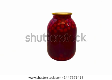 On a white background closed glass jar with cherry compote