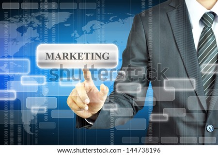 Businessman touching MARKETING sign