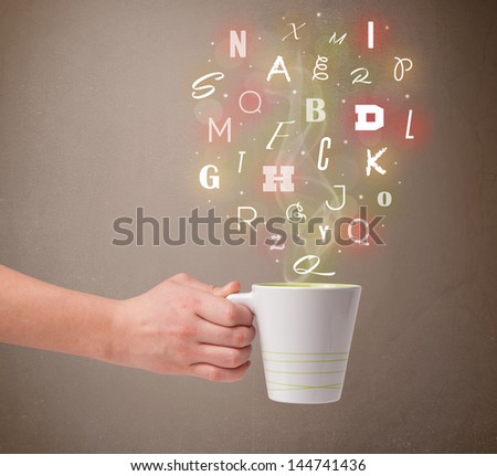 Coffee cup with colorful letters, close up