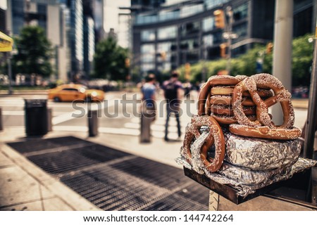 Hot dog and Pretzels on a vendor's stand near Columbus Circle, Manhattan. Royalty-Free Stock Photo #144742264