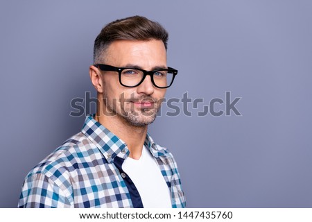 Close up side profile photo handsome he him his guy intelligent reliable manager financier peacefully cute smile neat bristle beard wear specs casual plaid checkered shirt isolated grey background