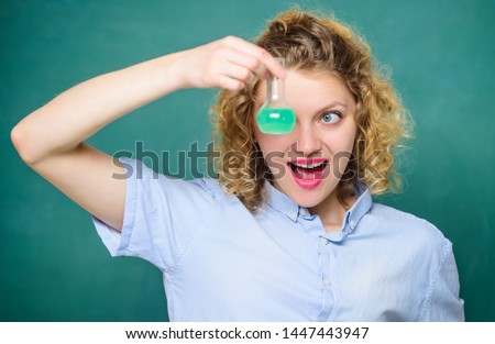Science and education. girl hold chemical flask with liquid. happy student with beaker. biology experiment. sample formula. chemistry research results. scientist at school lab. school lesson.