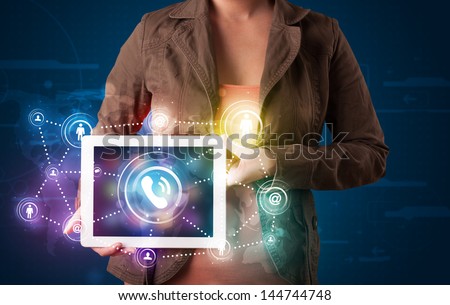 Young lady showing social networking technology with colorful lights