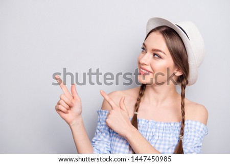 Portrait of charming nice pretty youth millennial have decision choice decide choose adverts indicate information isolated wear off-shoulders checkered blouse grey background