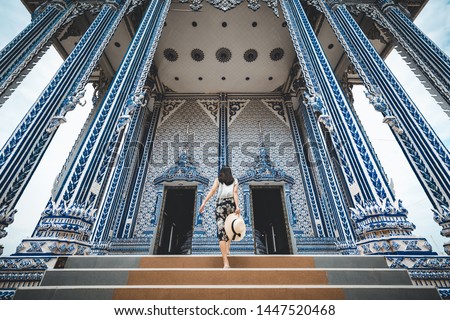 Asian traveller woman travel in Wat Pak Nam Khaem Nu temple, Chanthaburi, Thailand Royalty-Free Stock Photo #1447520468