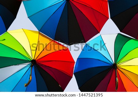 rainbow colored umbrellas hanging in the air, Odessa, Ukraine
