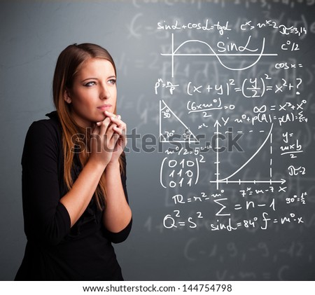 Beautiful young school girl thinking about complex mathematical signs