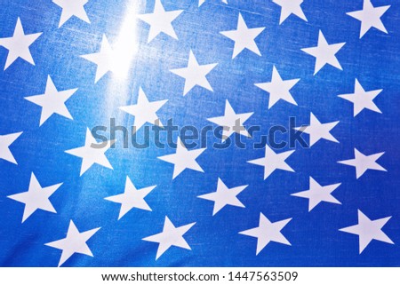 Closeup view of stars on blue background of United States of America flag. Greeting card to celebrating Independence day of America USA or Memorial, Labor day. Happy national flag day concept