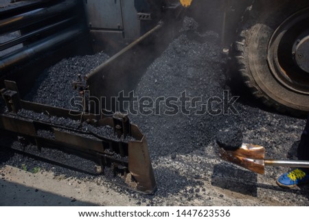 Construction work for a road and highway repair,Concept: Transportation symbol for vehicle safety,Worker operating asphalt road city