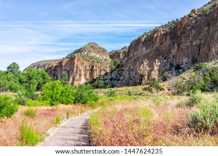 Main Loop path trail in Bandelier National Monument in New Mexico in Los Alamos with canyon cliffs Royalty-Free Stock Photo #1447624235